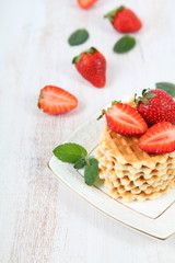 Waffles, mint and ripe strawberries