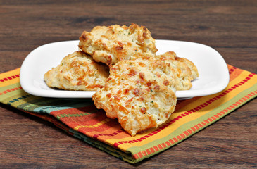 Biscuits with cheddar cheese, garlic and parsley.  Selective foc