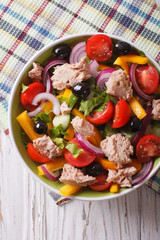 salad with tuna fish and vegetables close up vertical top view
