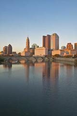 Fototapeta na wymiar Scioto River and Columbus Ohio skyline in autumn with sunset reflection in water