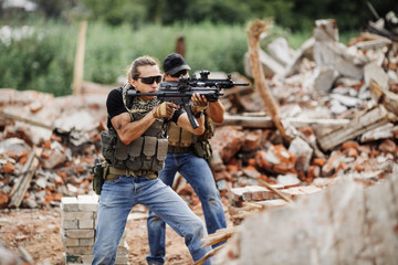 woman soldier writes marker on transparent glass