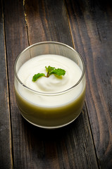 Homemade yogurt on wooden background