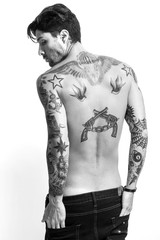 Handsome and sexy tattooed man back portrait black and white
