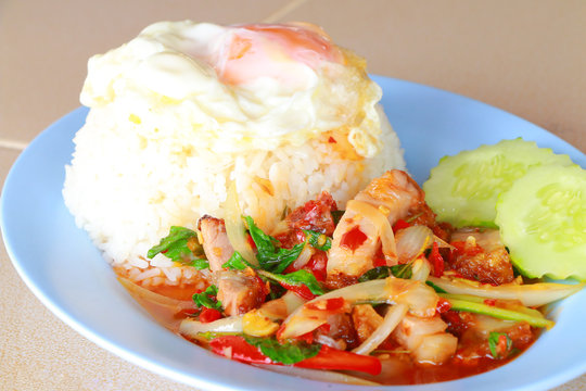 Basil Stir with fried egg, Thailand cuisine style.