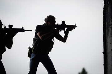 Silhouette of terrorist with assault rifle