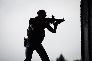 Silhouette of terrorist with assault rifle