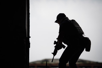 Silhouette of terrorist with assault rifle