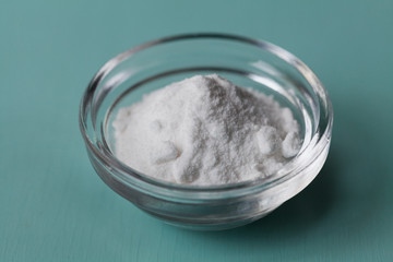 Baking soda, Sodium bicarbonate in glass bowl on wooden table