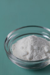 Baking soda, Sodium bicarbonate in glass bowl on wooden table