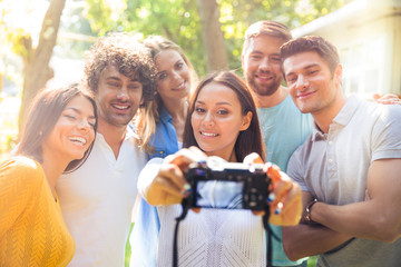 Friends making selfie photo on camera