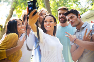Friends making selfie photo on camera