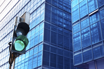 Traffic light with urban background