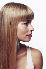 Naklejka premium Profile of gorgeous young woman in studio
