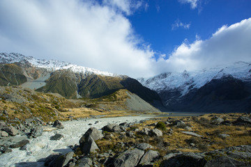 Fototapeta premium Mueller Lake is fed from melting of the Mueller glacier, in the Hooker valley of Aoraki Mount Cook National Park. Overflow of the lake forms the Hooker river.