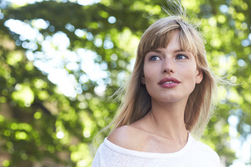 Beautiful blond woman looking away,  outdoors