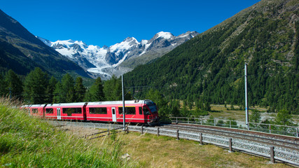Swiss mountain train Bernina Express crossed Alps - obrazy, fototapety, plakaty