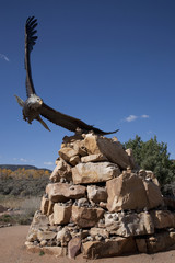 Fototapeta na wymiar Sculptor of flying Bald Eagle, Dennis Weaver Memorial Park, Ridgeway, CO.
