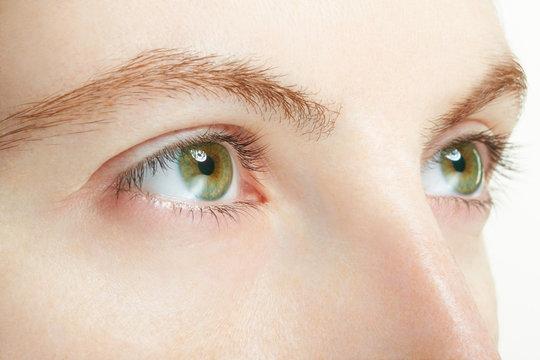 Woman green eyes macro, vision concept
