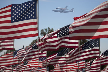 The final flight of the Space Shuttle Columbia flies on 9/21/12 over US Flags at Peperdine University in Malibu, CA.