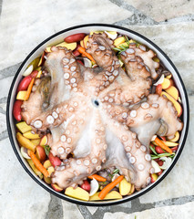Preparing and Cooking of octopus in traditional Balkan Greek Med