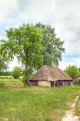 Obraz na płótnie Canvas Ukrainian wooden barn Thatched locked uph