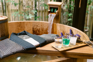 Onsen series : wooden bathtub with sample of mineral water