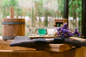 Onsen series : wooden bathtub with sample of mineral water