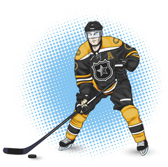Fototapeta premium ice hockey player black and yellow