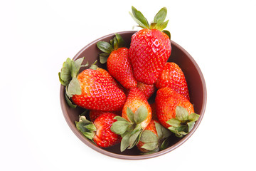 Closeup Fresh Strawberries in Bowl Isolated on White Background.