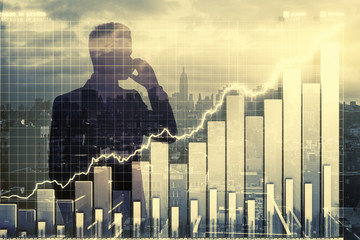 Double expplosure with businessman silhouette and business chart