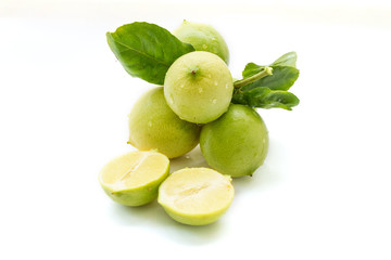 close up of fresh limes isolated on white