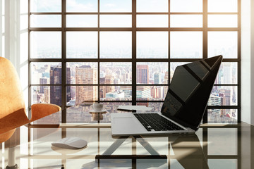 workplace in a white loft interior with city view