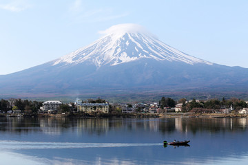 Mount Fuji in kawaguchiko lake and fishing boat.