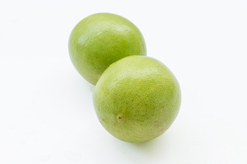close up of fresh limes isolated on white