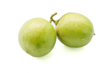 close up of fresh limes isolated on white