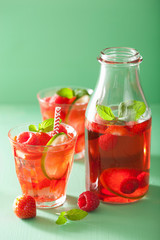 Fototapeta na wymiar summer strawberry raspberry lemonade with lime and mint