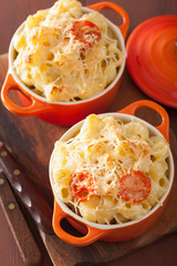 baked macaroni with cheese in orange casserole