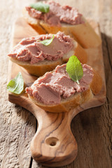 healthy chicken liver pate with sage in jar and on bread