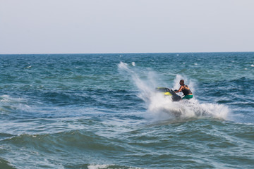 Man on jet ski with high speed and adrenalin.