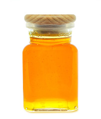 honey in a jar isolated on white background