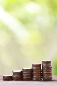 Silver Coin Stack In Business Growth Concept On Wood Floor.