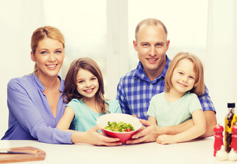 happy family with two kids with salad at home