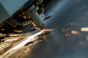 Deurstickers Laser cutting of metal sheet, close-up © Wisky
