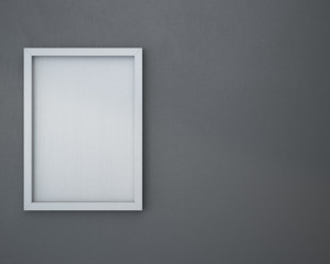 Blank frame on gray wall.