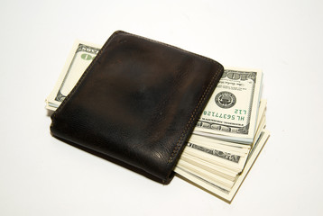 Old  wallet with banknotes of US dollars inside