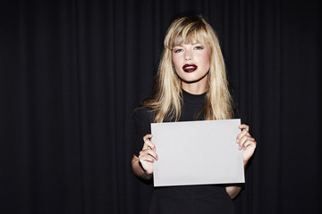 Sexy young woman with blank message, portrait