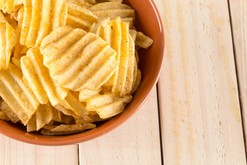 potato chips on wood background