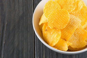 potato chips on wood background