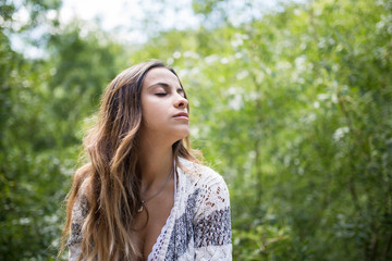 Beautiful young woman with closed eyes
