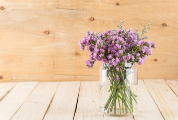 statice flower bouquet  on wood background